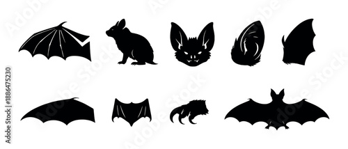 Silhouette collection of bats and cats with glowing eyes on black background