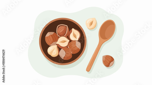 Overhead view of shelled and unshelled hazelnuts with a wooden spoon in a shallow bowl