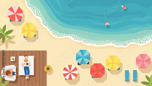Overhead view of people relaxing on a sandy beach with umbrellas and blue ocean waves