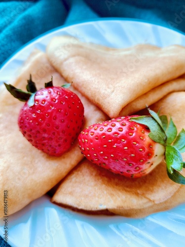 Stack of Golden Pancakes with Strawberries