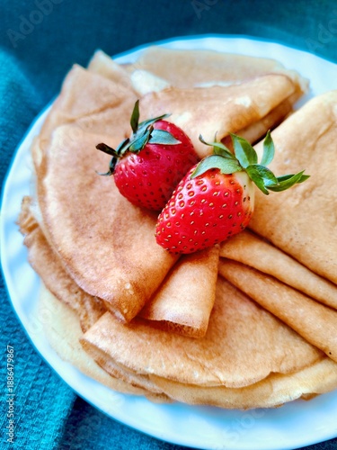 Stack of Golden Pancakes with Strawberries