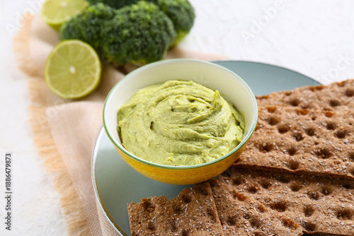 Bowl of tasty peas hummus w...