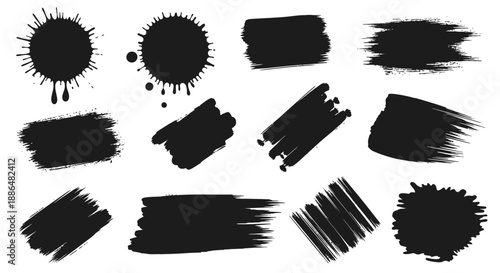A collection of black ink splatters and brush stroke elements on a white background.