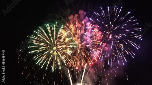  Layered fireworks bursts with realistic sparks and smoke, high-contrast colors against dark sky, semi-transparent for easy overlay in post-production