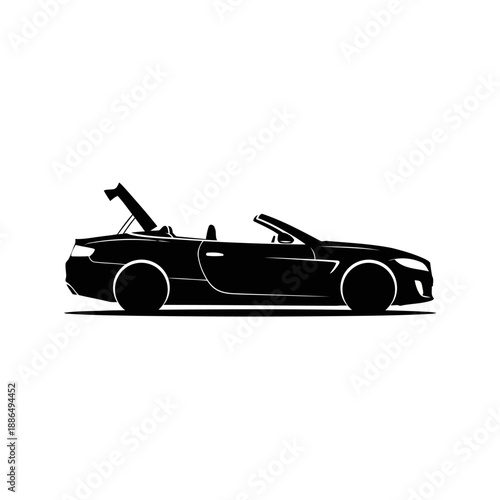 A sleek black convertible sports car with its top open