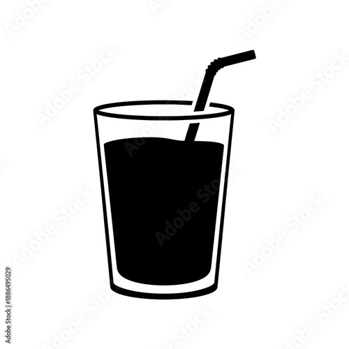 Glass of dark liquid with straw