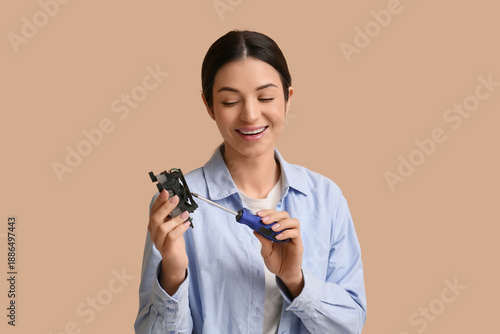 Female inventor with screwd...