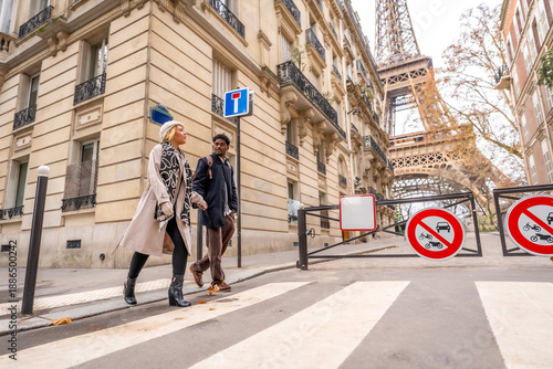 Wallpaper Mural Diverse couple traveling in paris near the eiffel tower Torontodigital.ca