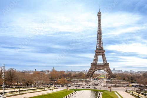 Eiffel tower dominating paris cityscape on cloudy day