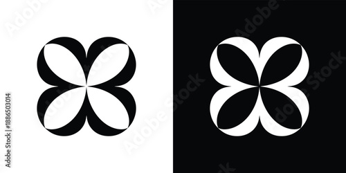 Abstract floral design with symmetrical black and white clover like shapes