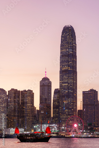 Photography Hong Kong city skyline at sunset with glowing sky and skyscrapers