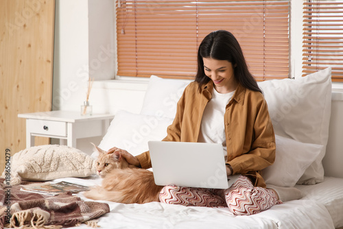 Pretty young woman with lap...