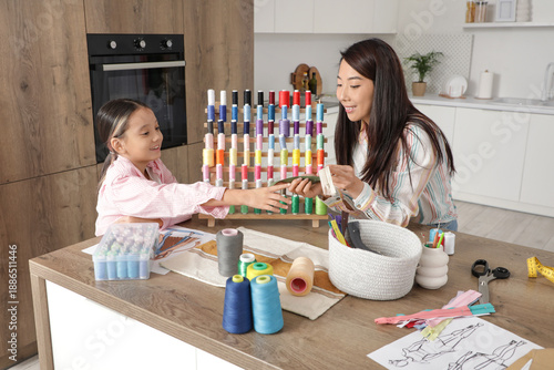 Happy Asian mother with her...