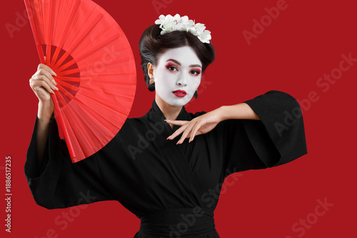 Beautiful young geisha with...
