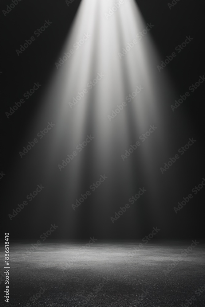 Obraz premium vertical image strong light falls from above onto bare stage in dark setting. area is empty and ready for performances. light creates open and inviting space for activities