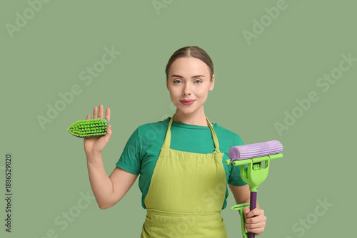 Young woman with floor mop ...