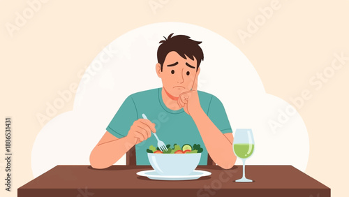 Sad man contemplating salad and drink at a table