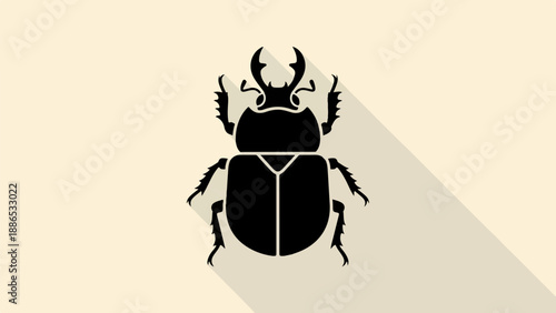 Stylized black beetle silhouette casting a long shadow on cream background