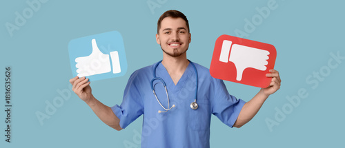 Handsome young happy male doctor with like and dislike icons on blue background