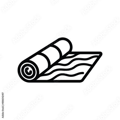 Black yoga mat rolled up on floor