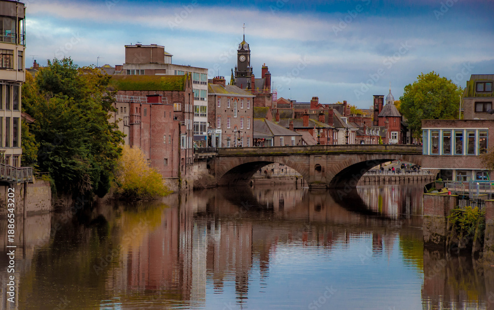 Obraz premium View of the City of York from the River Ouse with a reflection of the bridge.