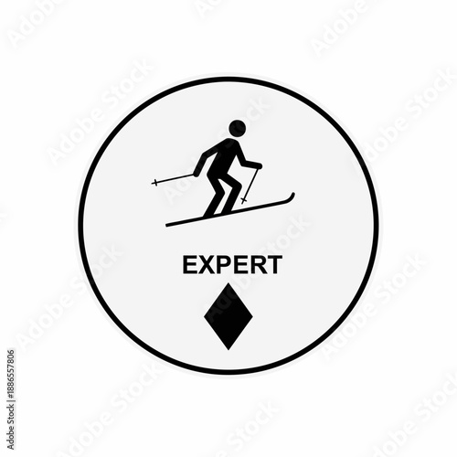 Black and white circular expert ski trail sign with a skier silhouette and a diamond symbol.