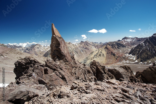 The enchanting beauty of the snowy mountains. The view of snow and rocks on the mountain tops.