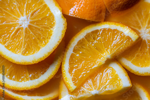 pile of fresh orange slices close up as vibrant citrus food background