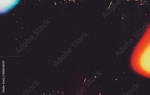 Vibrant light leaks noisy scratches dust film grain texture for photography edits. Grainy film burn or film overlay effect background. Warm multicolour light leaks glowing noisy scratches overlay.