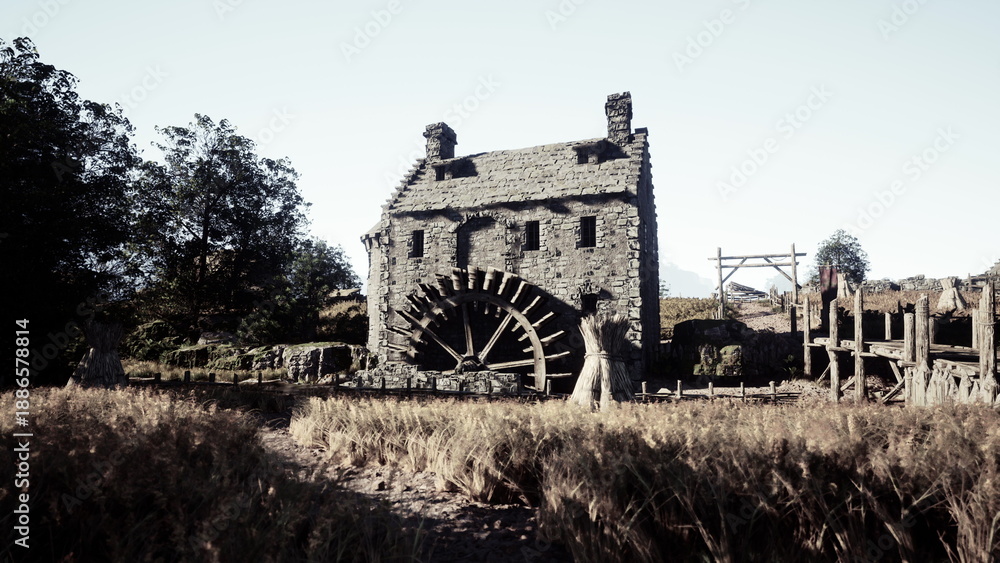 Fototapeta premium A charming stone mill stands proudly near swaying fields of golden wheat. Bright sunlight illuminates the scene, creating a peaceful rural atmosphere.