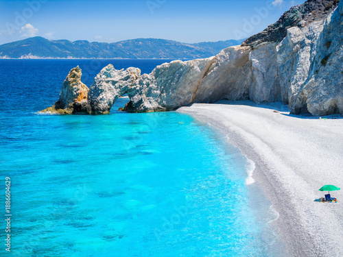 The beautiful beach of Lalaria at Skiathos island, Sporades, Greece, with the natural stone arch and turquoise sea, without people