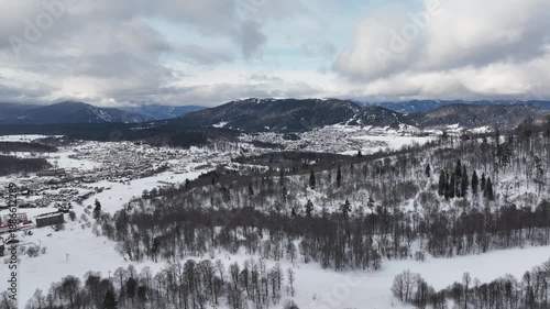 Aerial view of Bakuriani winter resort town with hotels and snow-covered mountains, Georgia 2026 winter