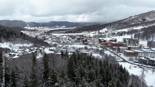 Aerial view of Bakuriani winter resort town with hotels and snow-covered mountains, Georgia 2026 winter