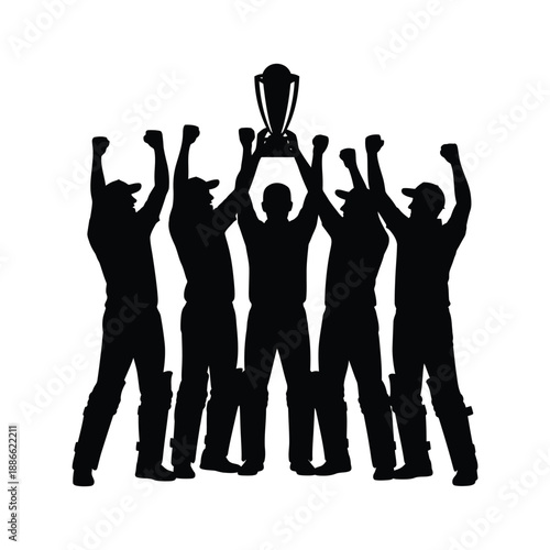 Celebrating victory Silhouette of a cricket team raising a trophy high