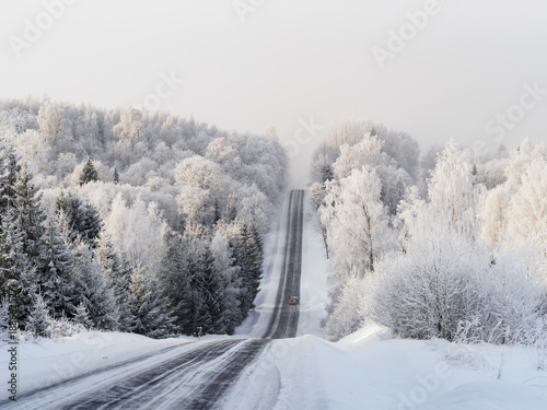 Car driving on snowy road