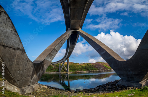 Kylesku Bridge spanning Loch Glencoul creating a modern architectural arch