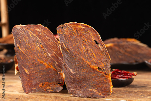 Dried beef crisps, beef crisps on a wooden background