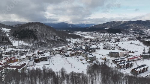 Aerial view of Bakuriani winter resort town with hotels and snow-covered mountains, Georgia 2026 winter