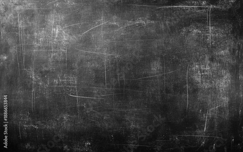 Black Blackboard Chalkboard texture. Empty blank dark dirty school board wall banner background backdrop with traces of chalk for text.