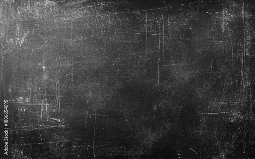 Black Blackboard Chalkboard texture. Empty blank dark dirty school board wall banner background backdrop with traces of chalk for text.