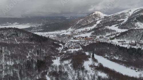 Aerial view of Bakuriani winter resort town with hotels and snow-covered mountains, Georgia 2026 winter