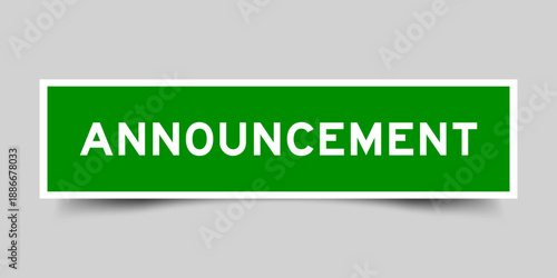 Green color square shape sticker label with word announcement on gray background