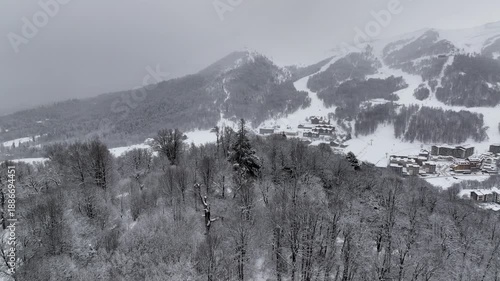 Aerial view of Bakuriani winter resort town with hotels and snow-covered mountains, Georgia 2026 winter