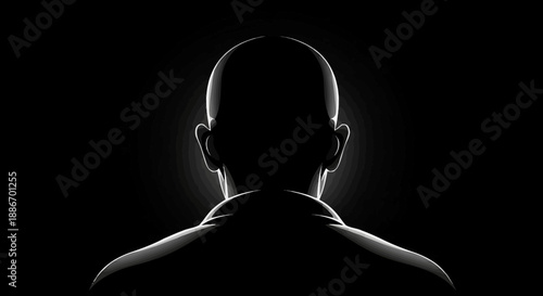 Silhouette of a Bald Person's Head and Shoulders Illuminated from Behind in Darkness