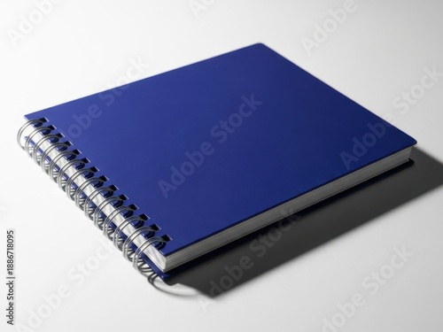 Wallpaper Mural Elegant blue spiral notebook on gray surface Torontodigital.ca