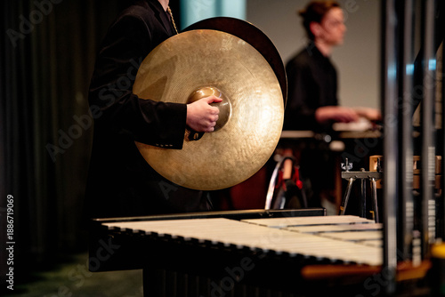 Εκτύπωση καμβά Close-up of teen's hands holding cymbals during high school band concert