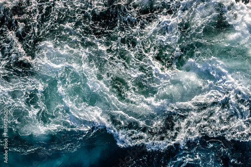 Fotografie Blue waves of water of the river and the sea meet each other during high tide and low tide