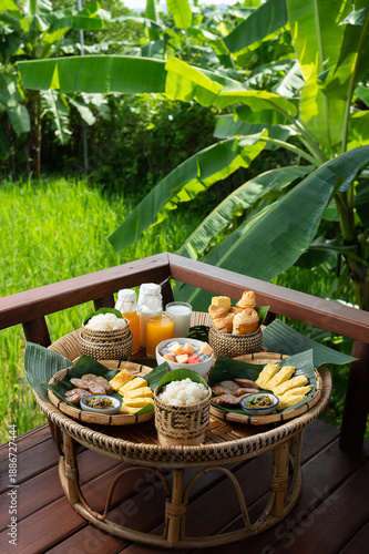 Traditional Breakfast Set Served on Bamboo Tray with Rice Field View
