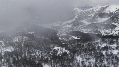 Aerial view of Bakuriani winter resort town with hotels and snow-covered mountains, Georgia 2026 winter
