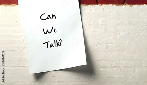 Note stick on white wall asking CAN WE TALK? - concept of difficult conversation, to approach for having serious talk to solve conflicts or relationship issues